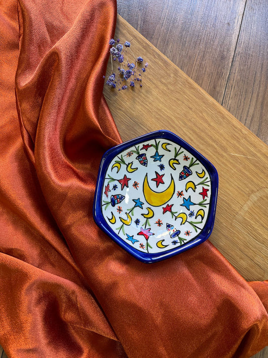 A handcrafted ceramic hexagonal plate