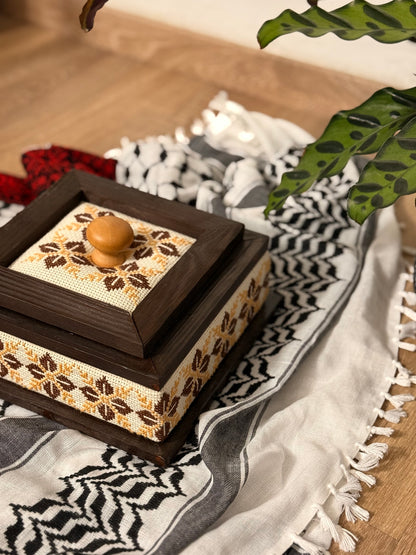 Wooden box adorned with Palestinian Tatreez embroidery