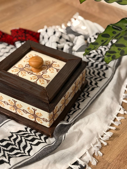 Wooden box adorned with Palestinian Tatreez embroidery