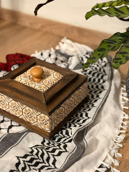 Wooden box adorned with Palestinian Tatreez embroidery