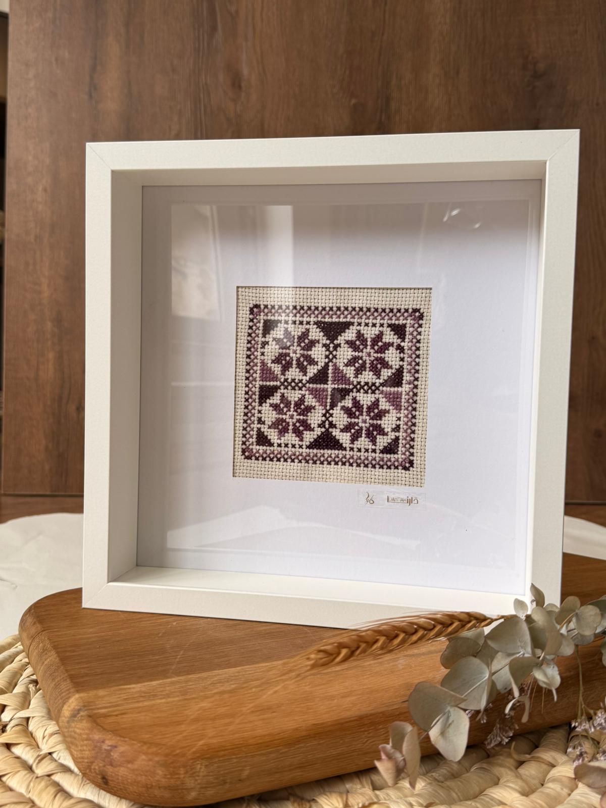handcrafted embroidery artwork beautifully presented in a frame
