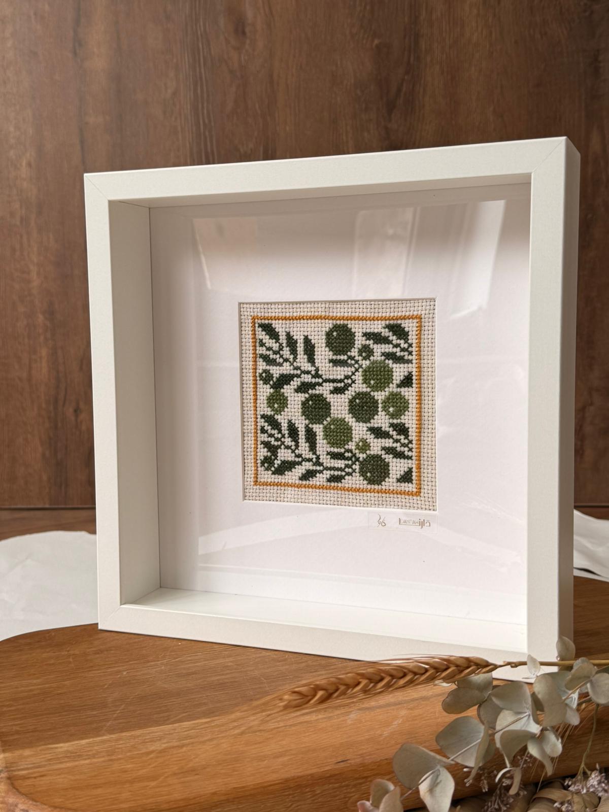handcrafted embroidery artwork beautifully presented in a frame